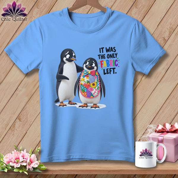 Light blue t-shirt with two penguins and text "IT WAS THE ONLY FABRIC LEFT."