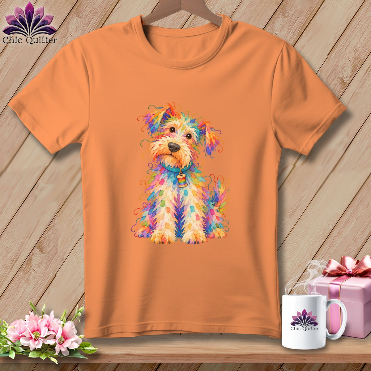 An orange crewneck t-shirt features a colorful, hand-drawn illustration of a fluffy dog on the front.