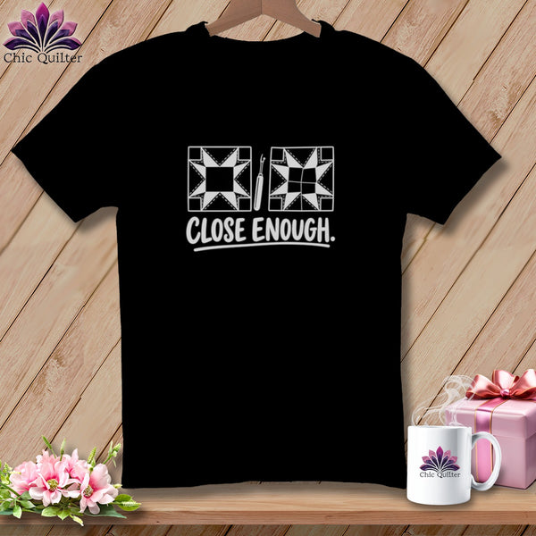 Black t-shirt with "CLOSE ENOUGH." and quilting icons.