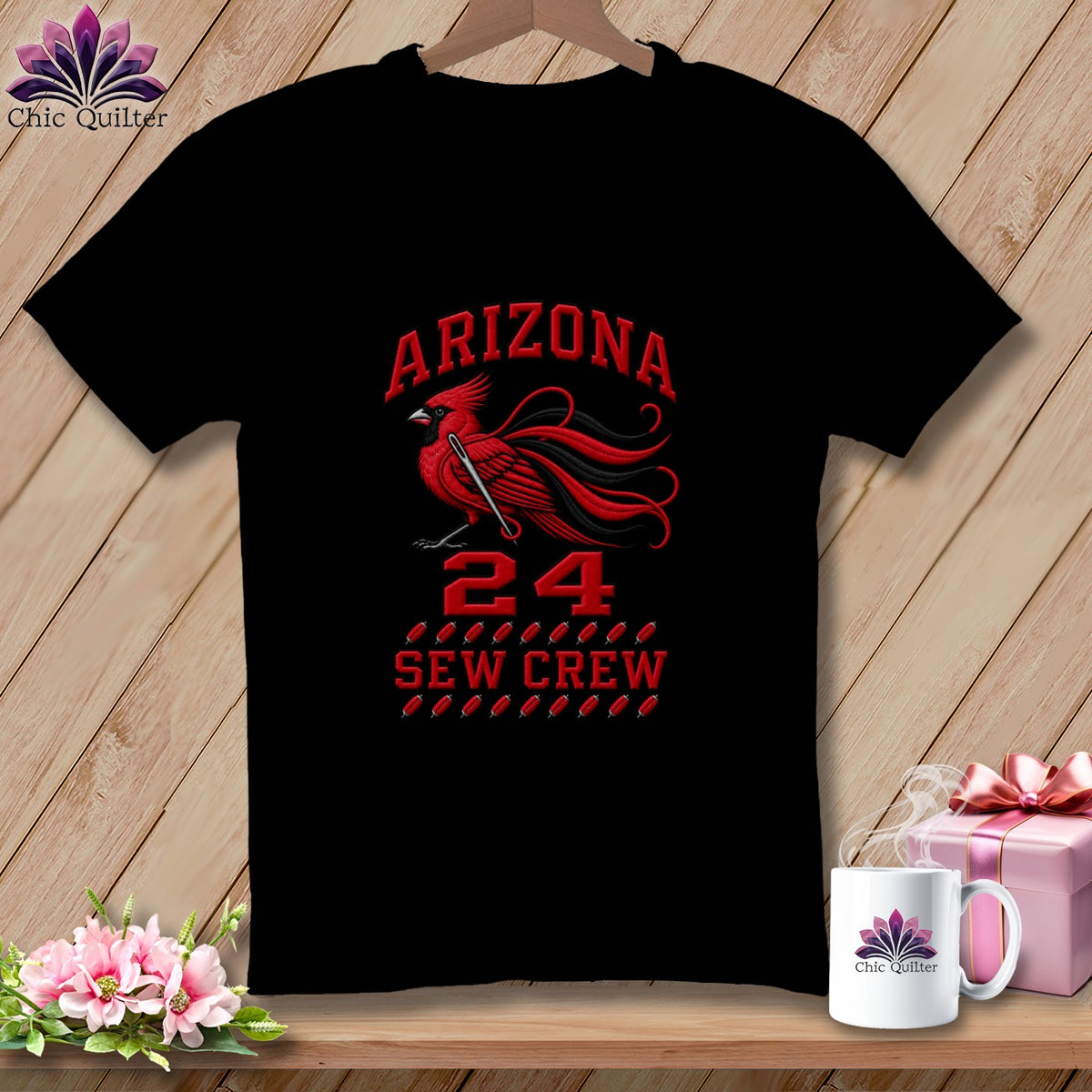 A black short-sleeved t-shirt featuring a red cardinal graphic, the text "Arizona 24 Sew Crew," and sewing-related motifs.
