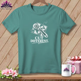 Teal t-shirt with graphic of rotary cutter on fabric and text 
