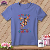 Purple t-shirt featuring a cartoon moose covered in a patchwork blanket, with text reading I Moose-t Buy More Fabric.