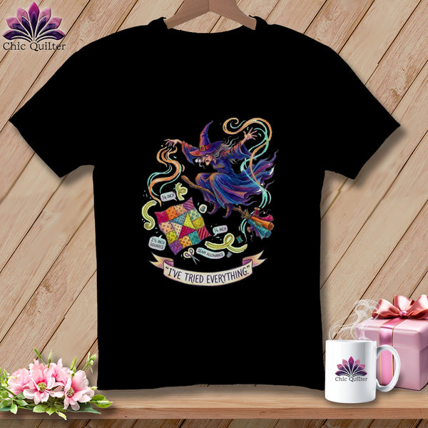 Black t-shirt with a whimsical witch flying with quilting tools and fabric, reading "I've Tried Everything."