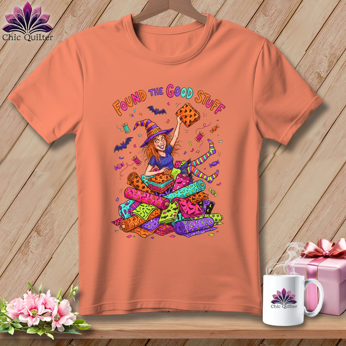 Orange t-shirt with cartoon witch holding fabric and the words "Found the Good Stuff".