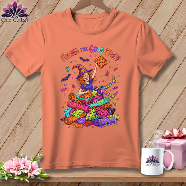 Orange t-shirt with cartoon witch holding fabric and the words "Found the Good Stuff".