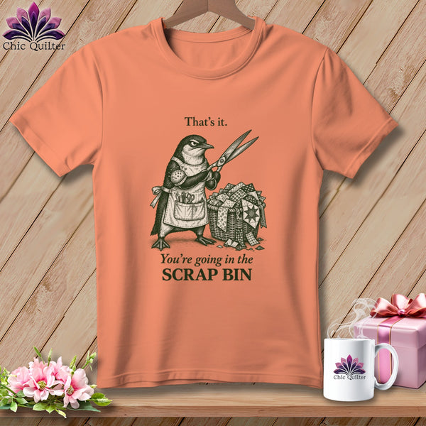 T-shirt with penguin holding scissors over a scrap bin, text "That's it. You're going in the SCRAP BIN."