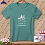 Teal t-shirt with white graphic of a house and text 