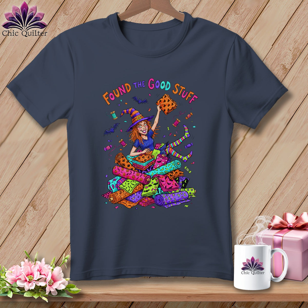 T-shirt with cartoon witch holding fabric with text "Found the Good Stuff".