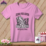 Pink t-shirt with a fox relaxing in a chair, sewing machine, and the text 