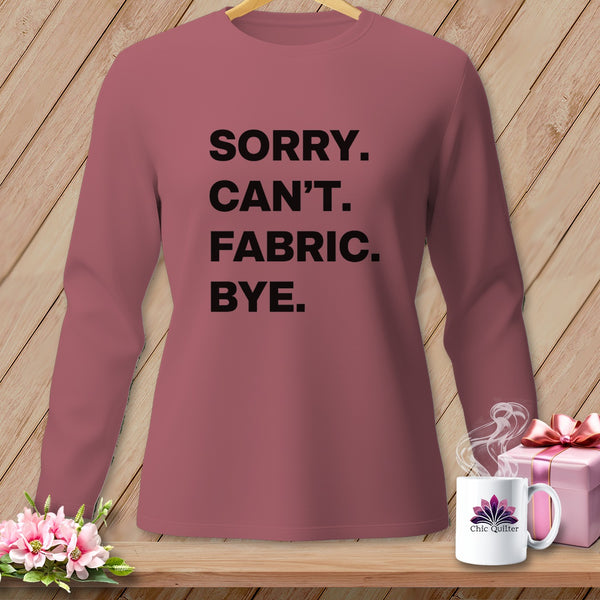 Long sleeve shirt with "Sorry. Can't. Fabric. Bye." text, gift box, and mug.