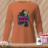 Orange long-sleeve shirt with a black cat in a witch hat holding a broom and text 