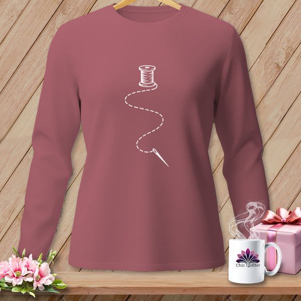 Rose long-sleeve shirt with white spool of thread and needle graphic.