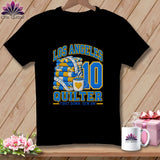 Black t-shirt featuring Los Angeles Quilter graphic with folded quilts, measuring tape, coffee mug, and number ten.