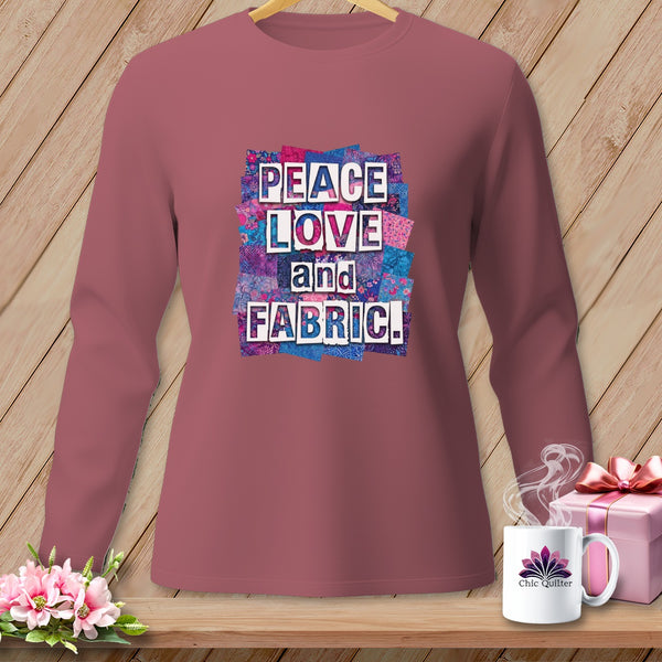Maroon long-sleeve shirt with "PEACE LOVE and FABRIC" text and floral quilt background.