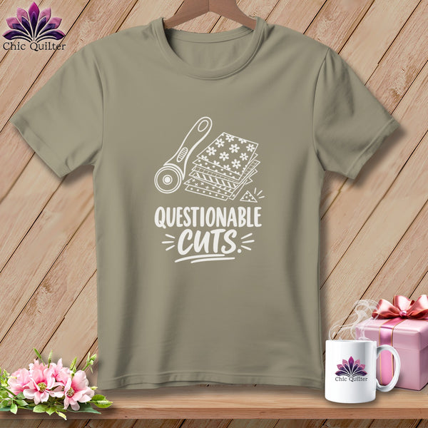 T-shirt with "Questionable Cuts" text, rotary cutter, and fabric stack graphic.