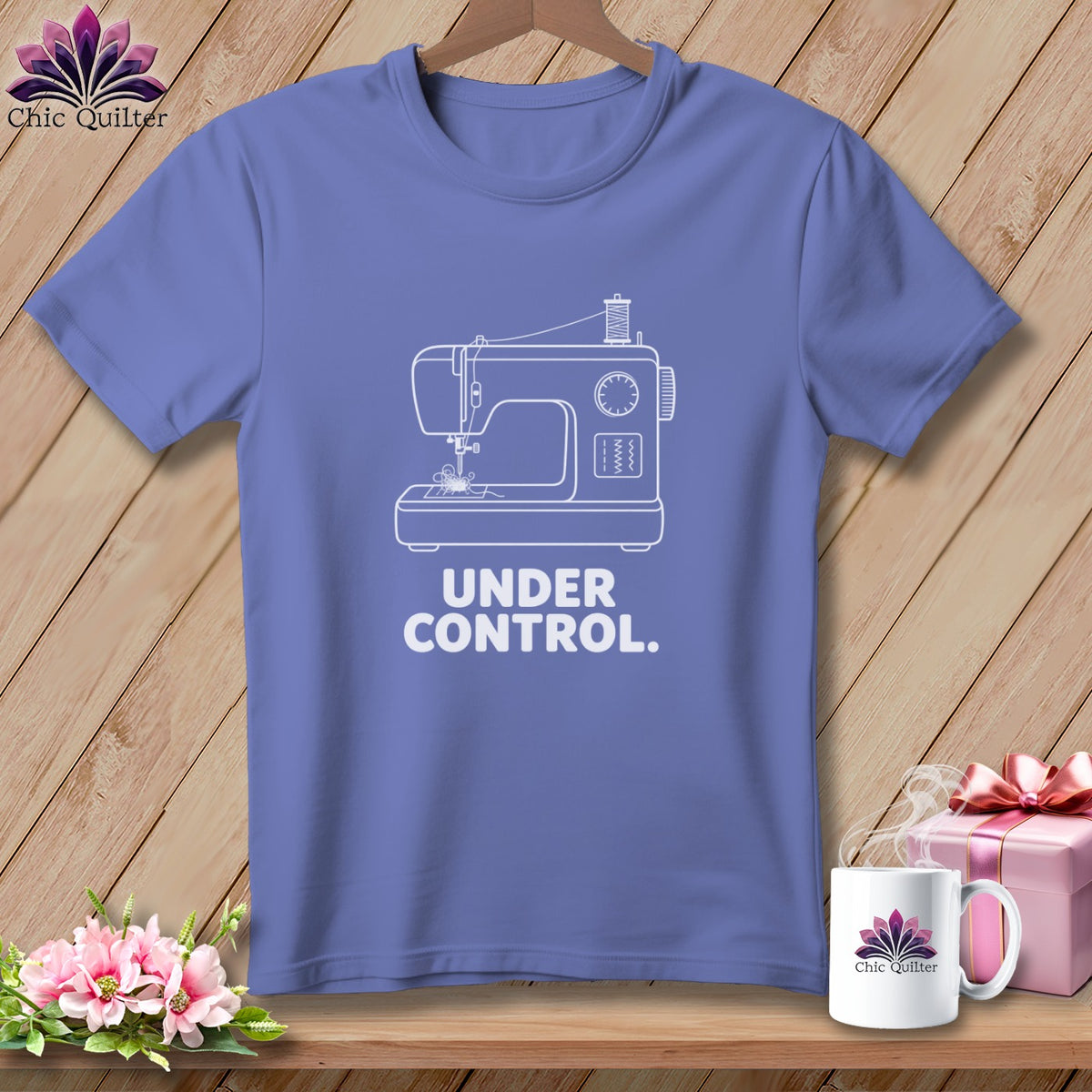 Purple t-shirt with white sewing machine graphic and text "UNDER CONTROL."