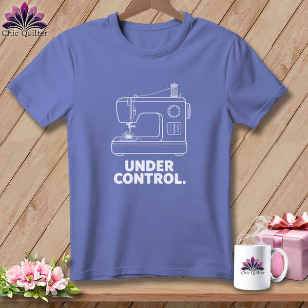 Purple t-shirt with white sewing machine graphic and text "UNDER CONTROL."
