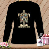 Black t-shirt with skeleton ribcage filled with sewing notions and text 