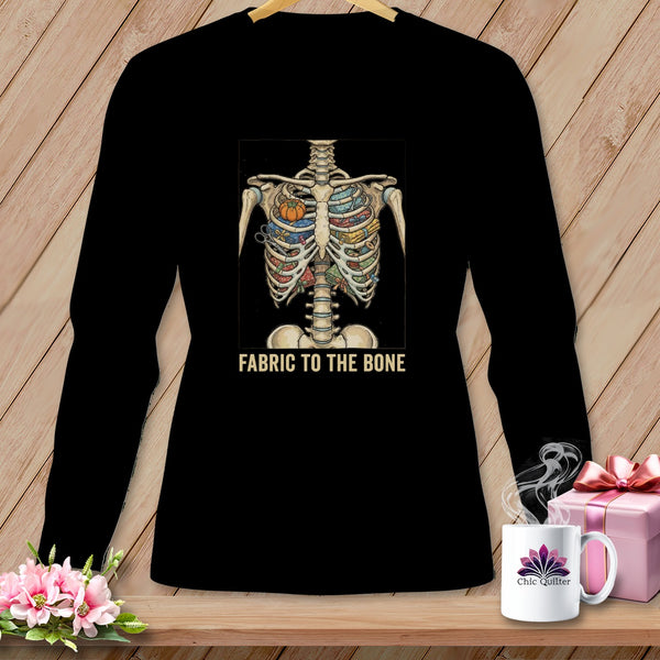 Black t-shirt with skeleton ribcage filled with sewing notions and text "FABRIC TO THE BONE".