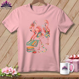 Pink t-shirt with two flamingos quilting, one cutting fabric and the other reading instructions.