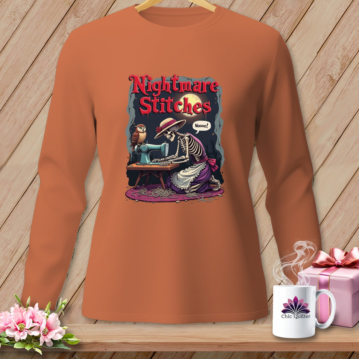 Skeleton sewing with owl, text Nightmare Stitches, on orange long-sleeve shirt.