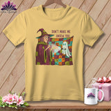 Yellow t-shirt with witch and ghost graphic and text 