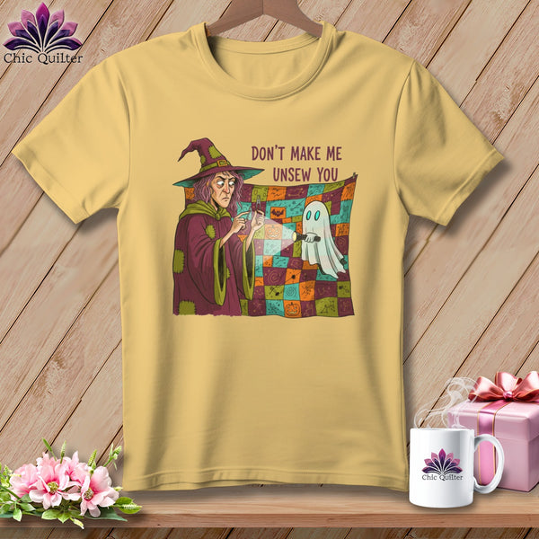 Yellow t-shirt with witch and ghost graphic and text "DON'T MAKE ME UNSEW YOU".