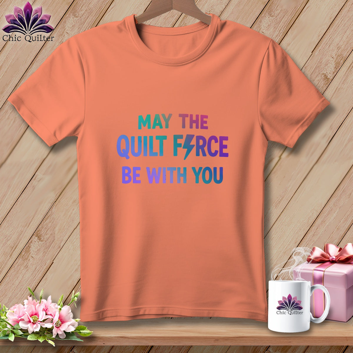 Peach t-shirt with "May the Quilt Force be with you" text and lightning bolt.