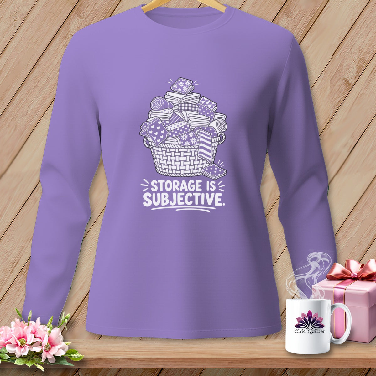 Purple long-sleeved shirt with a basket of fabric and the text "STORAGE IS SUBJECTIVE."