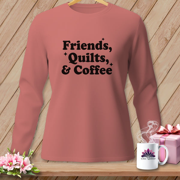Pink long-sleeve shirt with black text "Friends, Quilts, & Coffee".