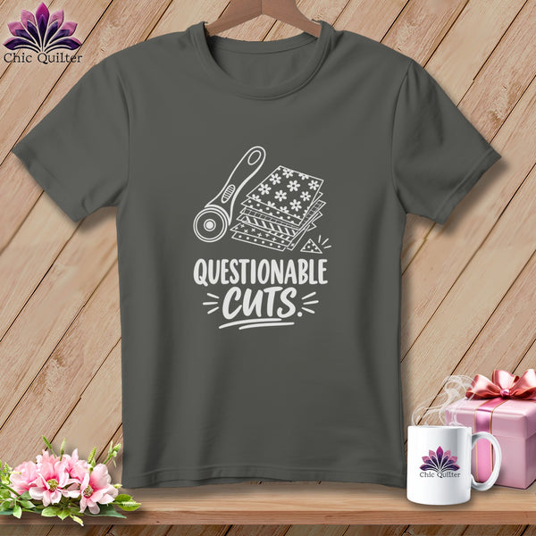 T-shirt with white graphic of rotary cutter, fabric stacks, and text "QUESTIONABLE CUTS".