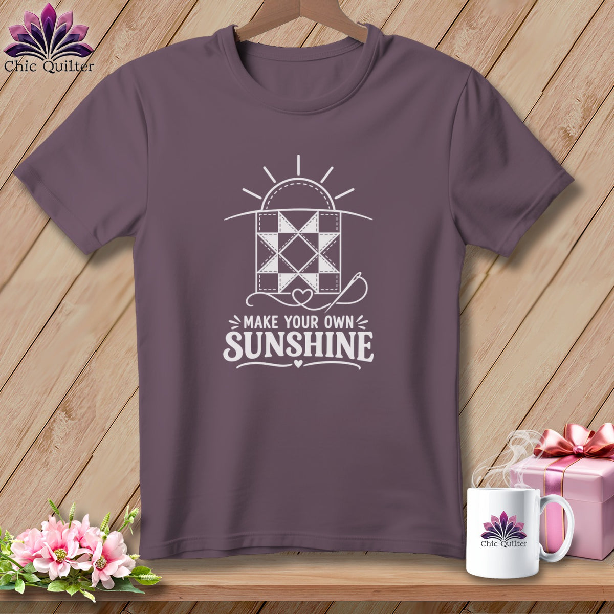Purple t-shirt with quilting design and "Make Your Own Sunshine" text.