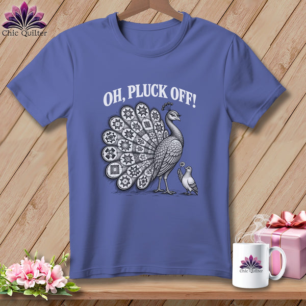 Periwinkle t-shirt with a white graphic of a peacock and pigeon, featuring the text "OH, PLUCK OFF!".