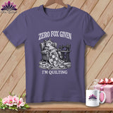 T-shirt with graphic of fox in chair with sewing machine and quilt, text reads 
