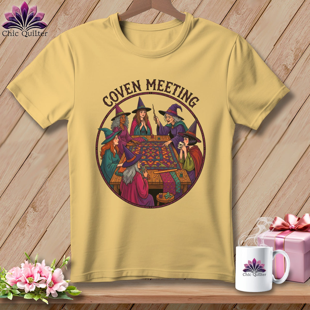 Witches gathered around a table, sewing a quilt with text "Coven Meeting".