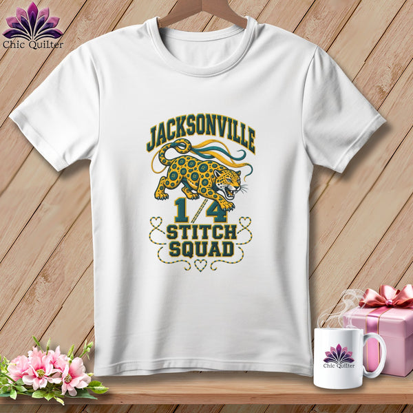 A white short-sleeved t-shirt with a graphic of a jaguar and Jacksonville 1/4 Stitch Squad text.