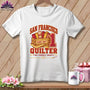 A white t-shirt features a San Francisco Quilter graphic with fabric bolts, a crate, and a large number one.