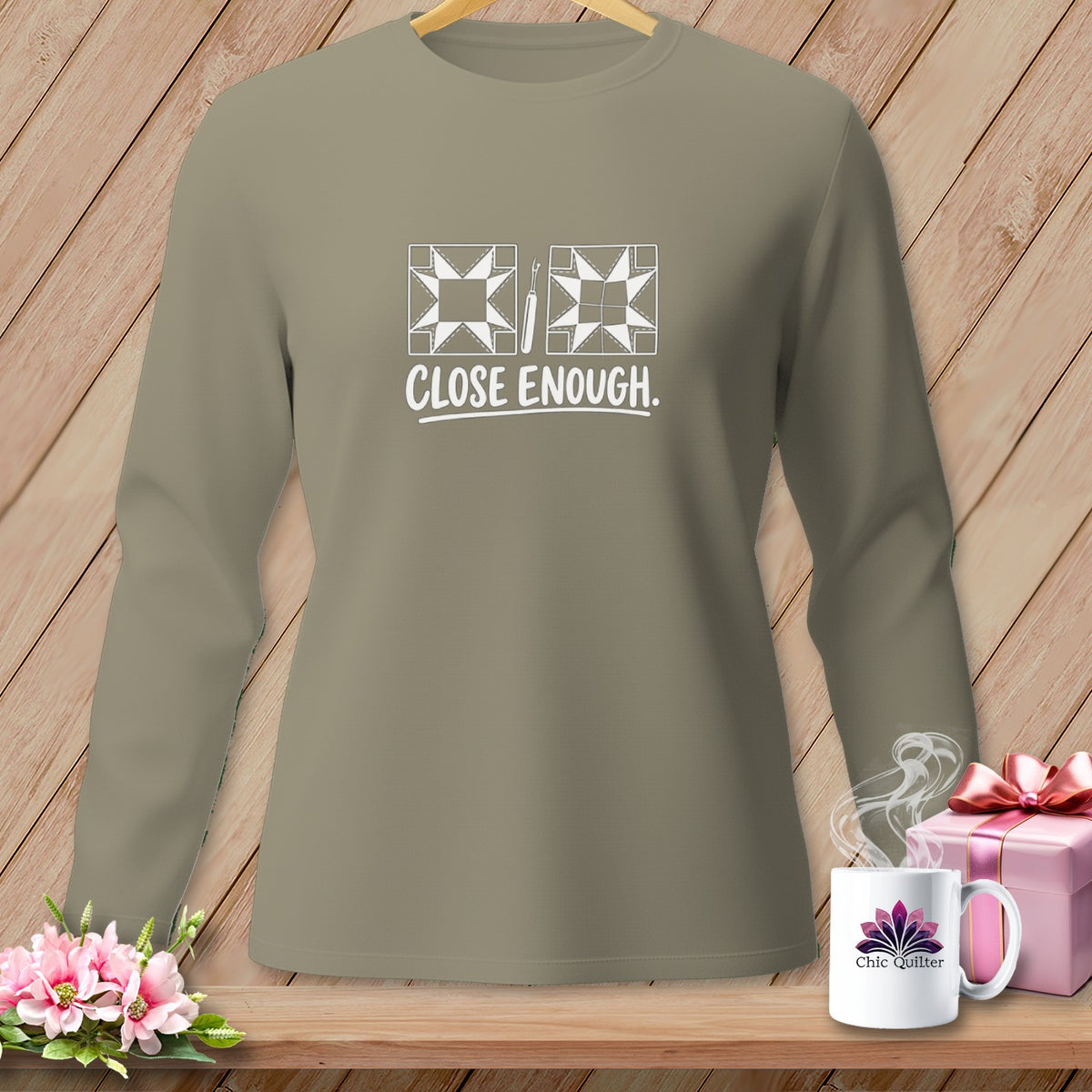 Tan long-sleeve shirt with quilting graphic and "CLOSE ENOUGH." text.
