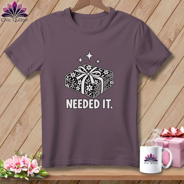 Purple t-shirt with stacked fabric and "Needed It." text.