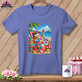 A periwinkle blue t-shirt with a graphic of a cat relaxing on a beach under a palm tree.