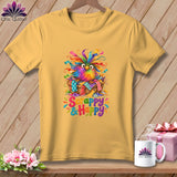 A mustard yellow t-shirt features a graphic of a colorful, feathered bird in a basket, with the text 