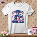 A white crewneck t-shirt featuring a quilting graphic with red and blue text reading Tennessee #1 Quilter.