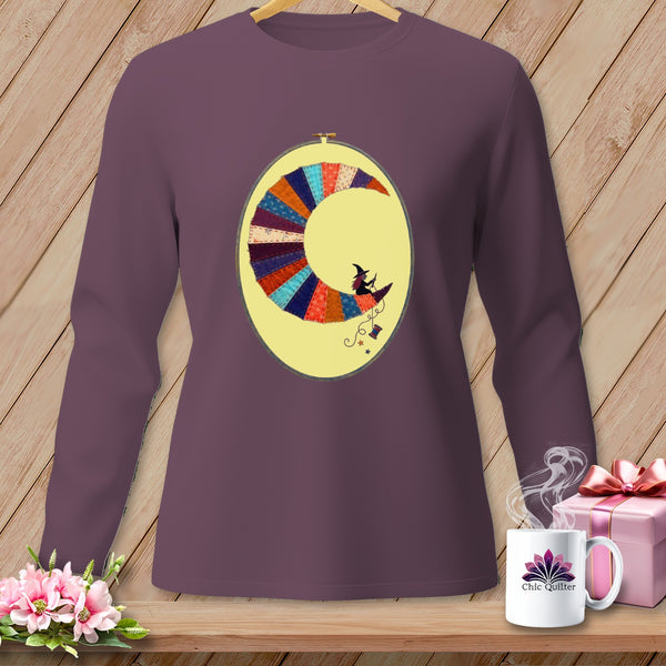 Purple long-sleeve shirt with a crescent moon embroidery featuring a witch riding a broomstick.