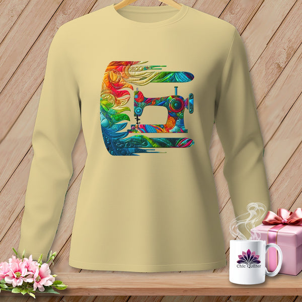 Long-sleeve beige sweatshirt with a colorful, abstract sewing machine graphic.