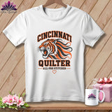 A white t-shirt featuring a roaring tiger graphic with orange and black text that reads Cincinnati Quilter All-Pro Stitcher.
