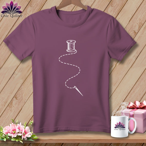 Plum t-shirt with white thread and needle graphic; "Chic Quilter" logo.