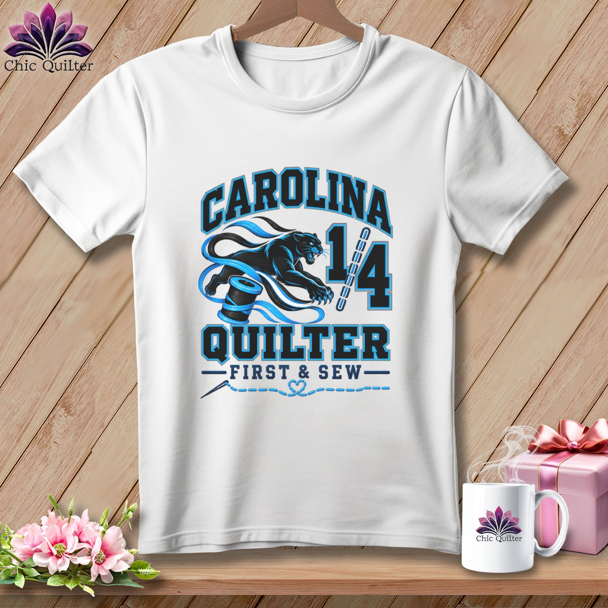 A white short-sleeve t-shirt with a blue and black Carolina Quilter graphic printed on the front.