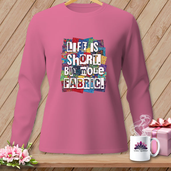 Pink long-sleeve shirt with "Life is short, buy more fabric" graphic.