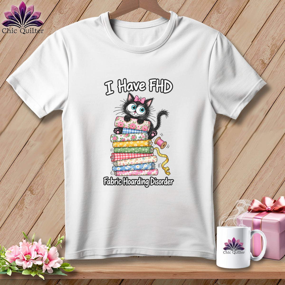 White crewneck t-shirt featuring a cartoon cat on a fabric stack with the text I Have FHD Fabric Hoarding Disorder.
