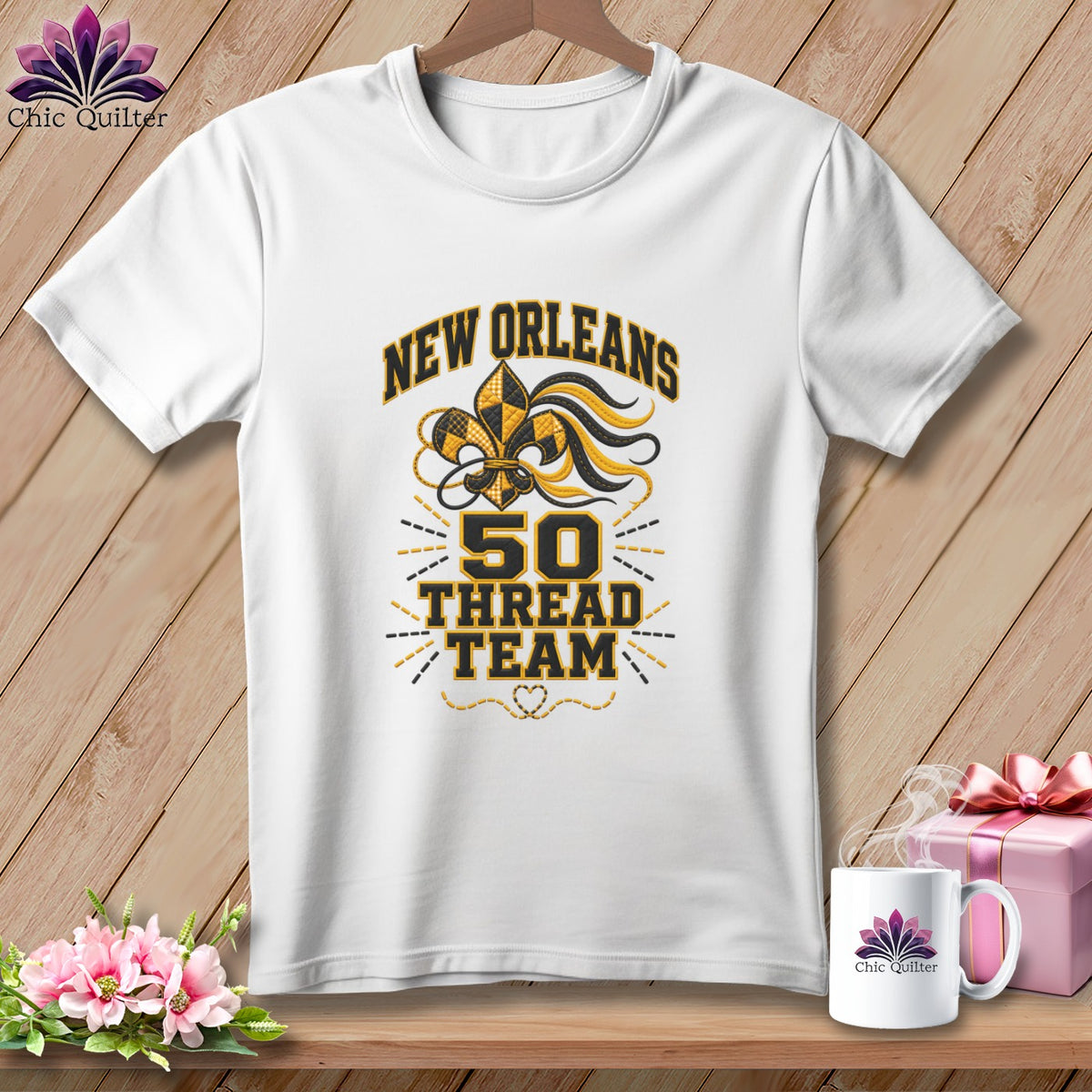 White crewneck t-shirt with black and gold New Orleans 50 Thread Team graphic on wooden background.
